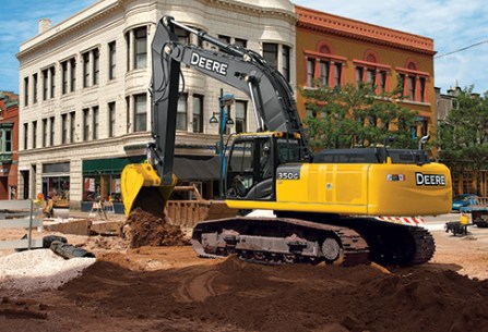 backhoe digging in a city